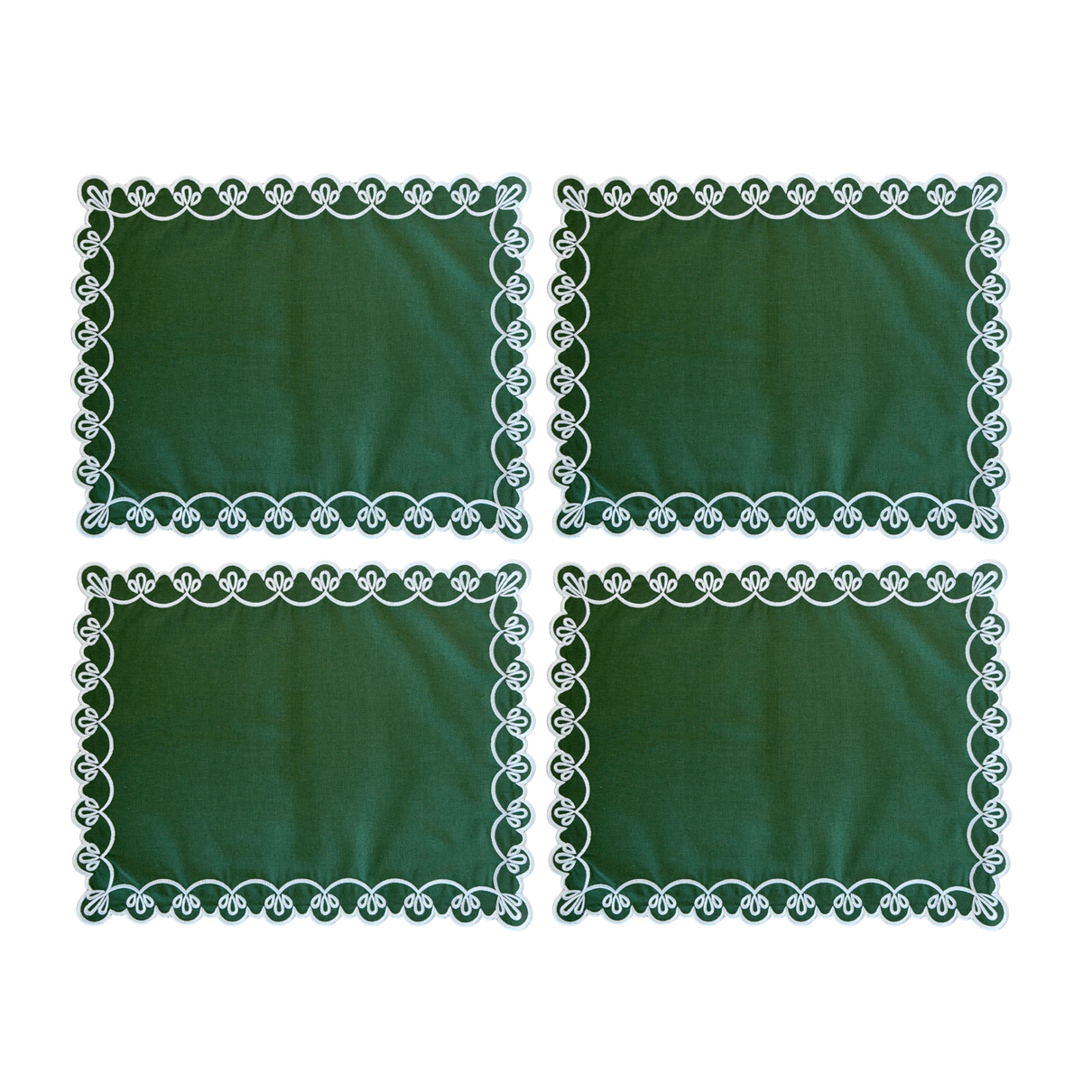 Set of four green placemats with ivory scallop embroidery