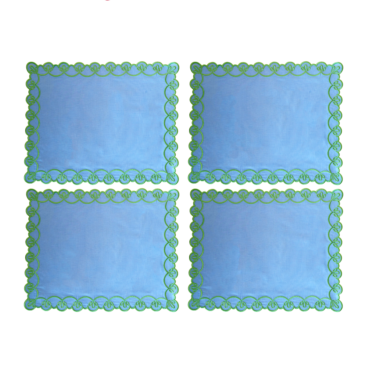 Set of four pale blue placemats with green scallop embroidery