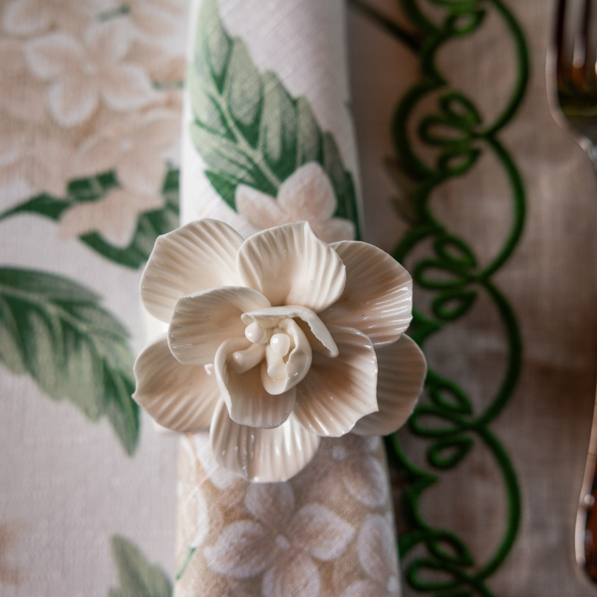 Cream Hydrangea Christmas table styled with Fleur napkin rings and Cream Hydrangea napkins