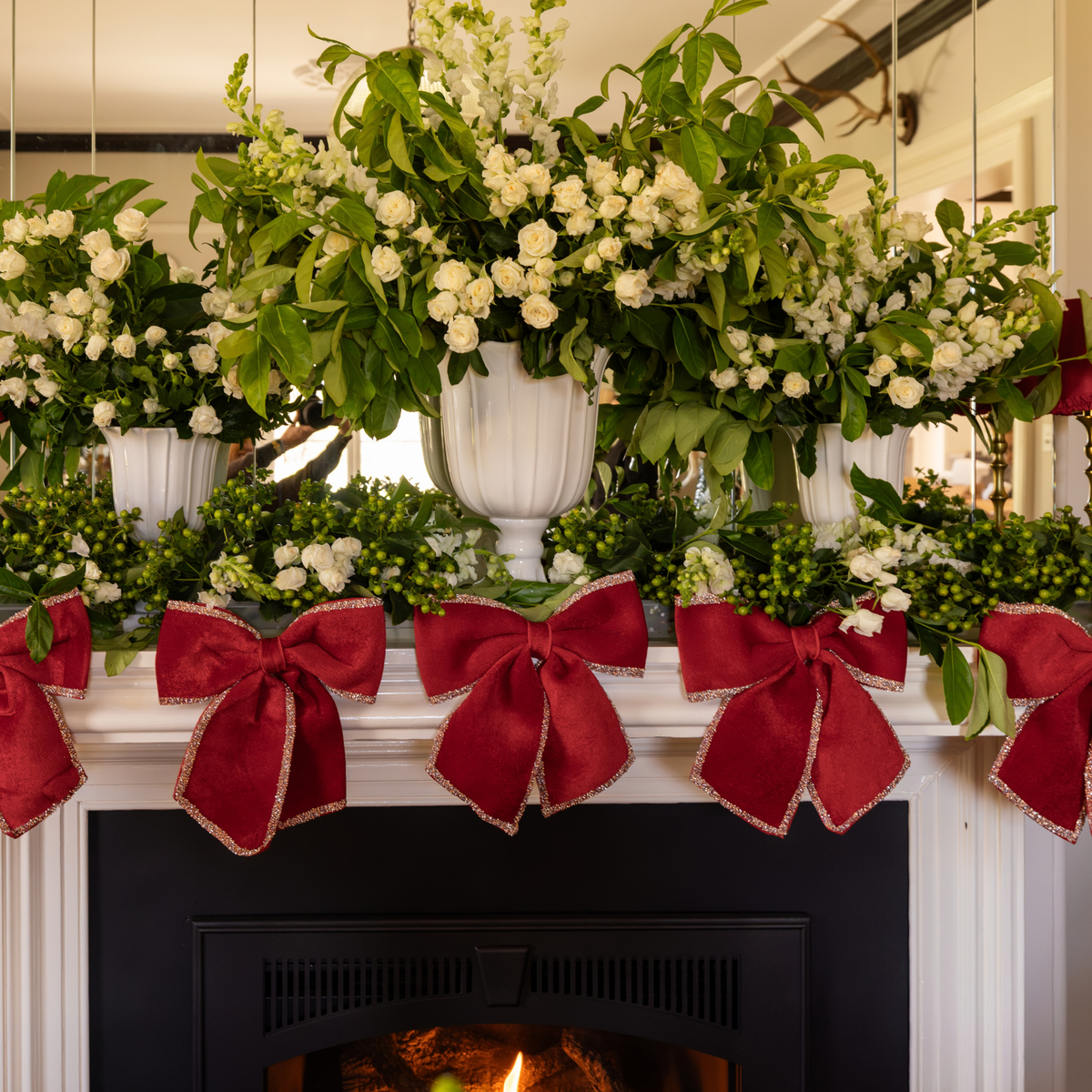 Pomegranate Christmas table styled with red velvet glitter trim bows