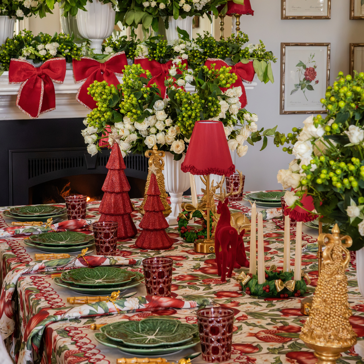 Pomegranate Christmas table styled with Pomegranate table cloth, Pomegranate napkins and red glitter Christmas trees