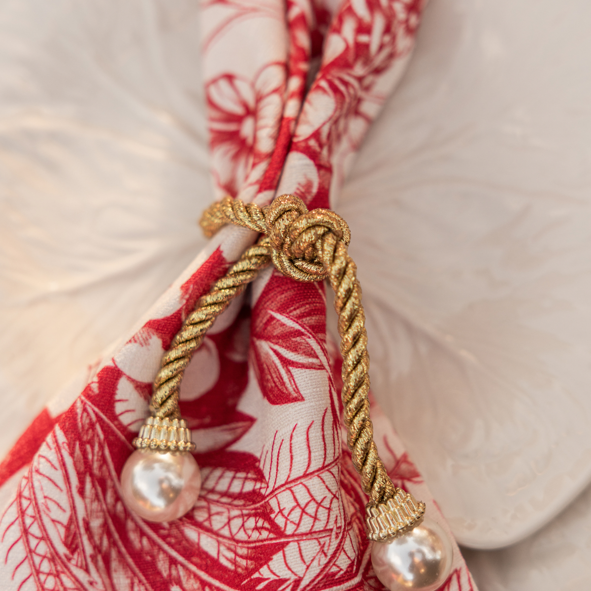 Red Toile Christmas table styled with pearl napkin rings and Red Toile napkins