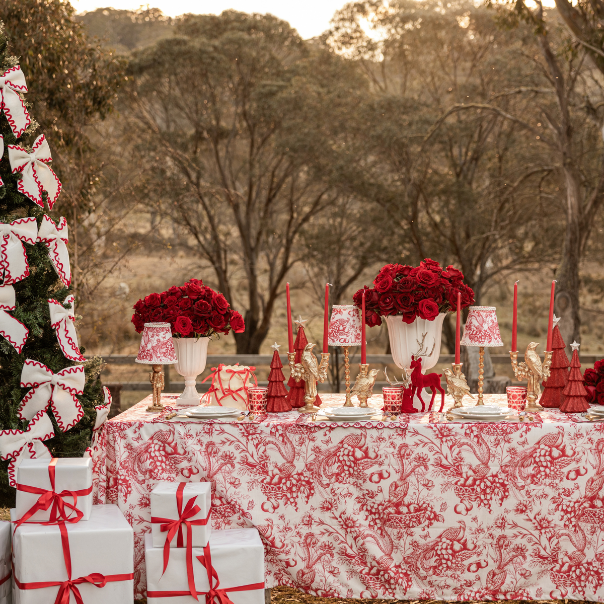 Red Toile Christmas table styled with Red Toile table cloth and cream and red ric rac bows