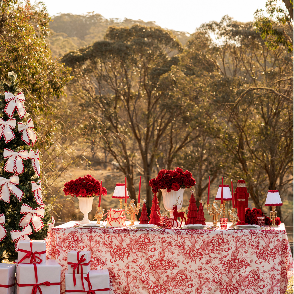 Red Toile Christmas table styled with Red Toile table cloth and cream and red ric rac bows