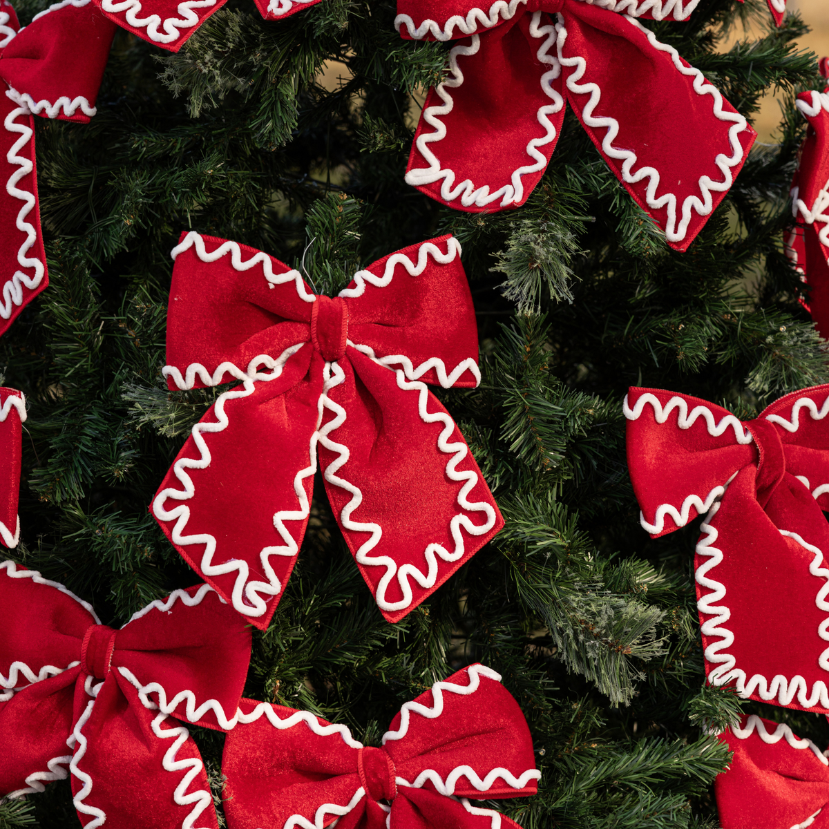 Spruce and Red Bow Christmas table styled with red and ivory ric rac bows