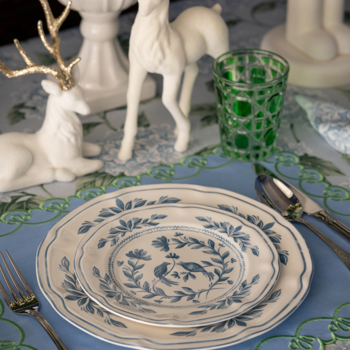 Blue Hydrangea Christmas table styled with white and blue Chinoiserie plates and cream velvet reindeer