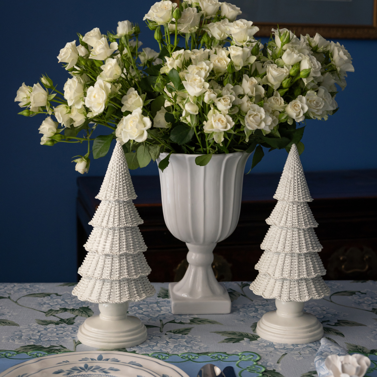 Blue Hydrangea Christmas table styled with white rattan Christmas trees