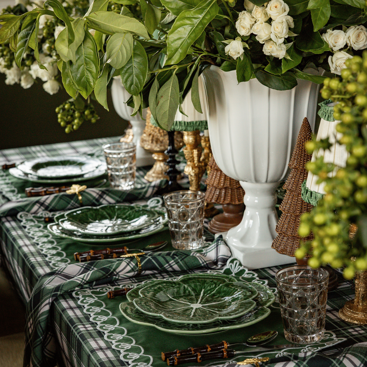 Green and Black Plaid Christmas table styled with Green and Black Plaid table cloth, green placemats with ivory embroidery and green cabbage plates