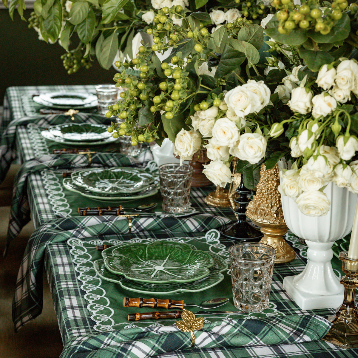 Green and Black Plaid Christmas table styled with Green and Black Plaid table cloth, green placemats with ivory embroidery and green cabbage plates