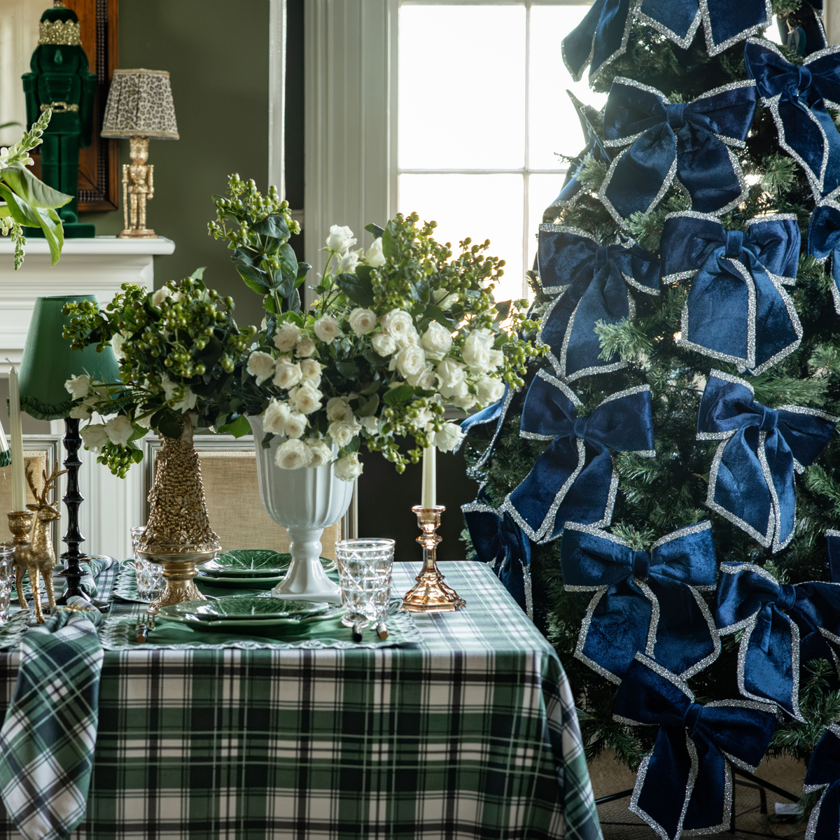 Green and Black Plaid Christmas table styled with Green and Black Plaid table cloth and navy velvet glitter trim bows
