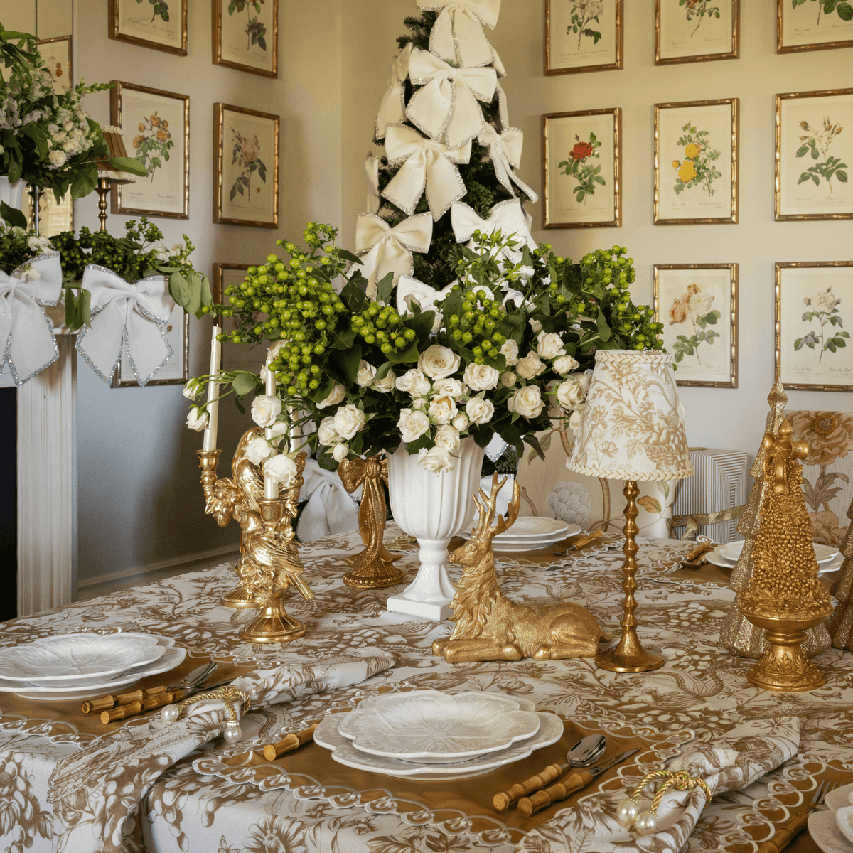 Gold Toile Christmas table styled with gold resting reindeer, gold bird double candle holder and Gold Toile lamp shade