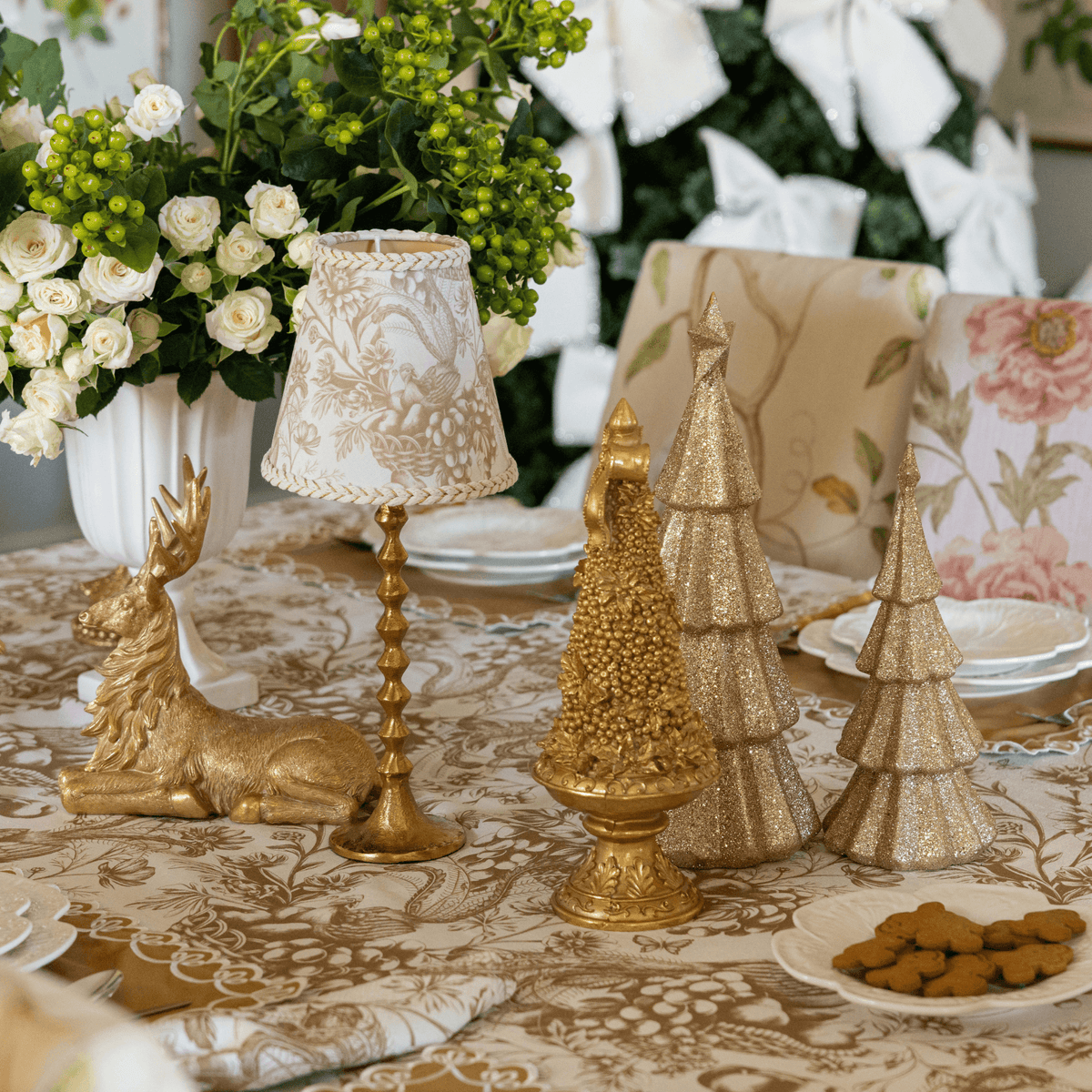 Gold Toile Christmas table styled with Gold Toile lamp shade and gold hammered lamp base