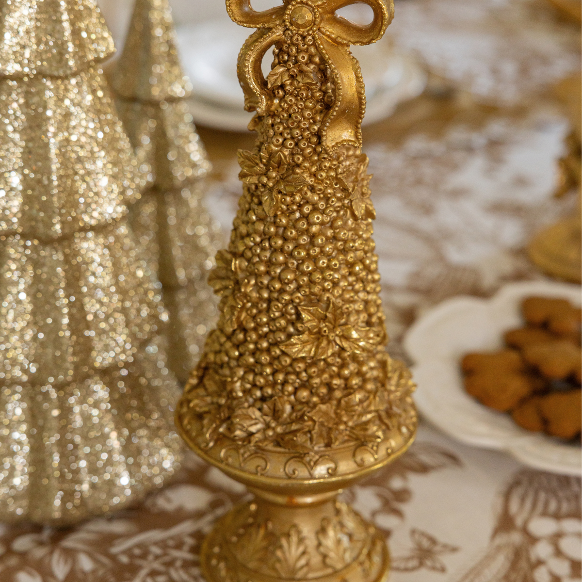 Gold Toile Christmas table styled with gold Christmas tree