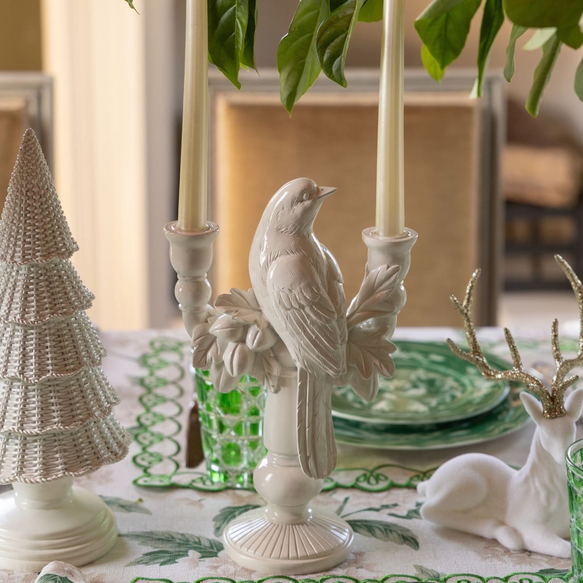 Cream Hydrangea Christmas table styled with white bird double candle holder, white rattan Christmas trees and cream velvet reindeer
