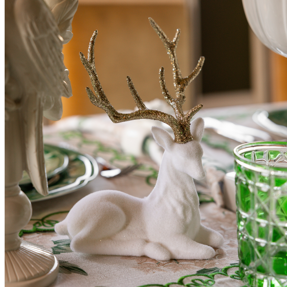 Cream Hydrangea Christmas table styled with cream velvet reindeer