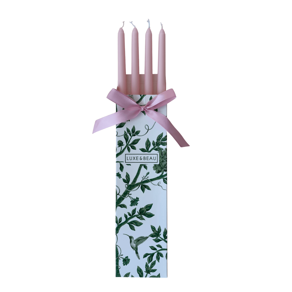 Set of four pink taper candles in a Luxe and Beau gift box with pink ribbon