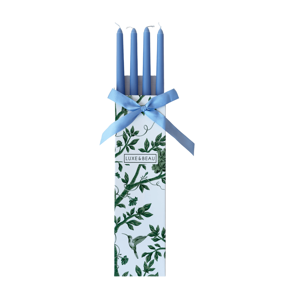 Set of four pale blue taper candles in a Luxe and Beau gift box with pale blue ribbon