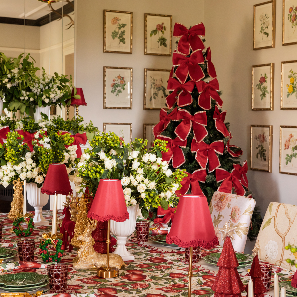 Pomegranate Christmas table styled with Pomegranate table cloth and red velvet glitter trim bows