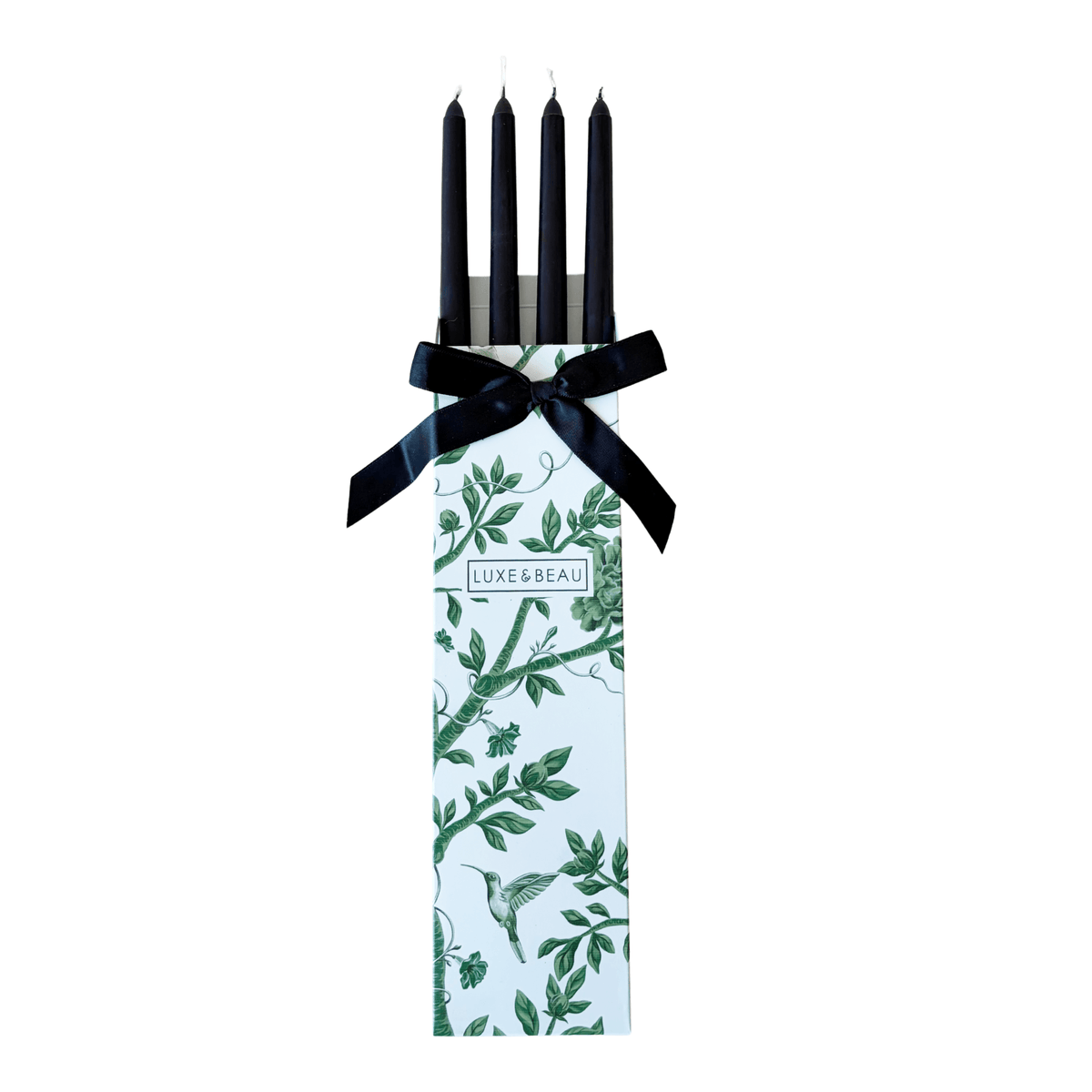 Set of four black taper candles in a Luxe and Beau gift box with black ribbon