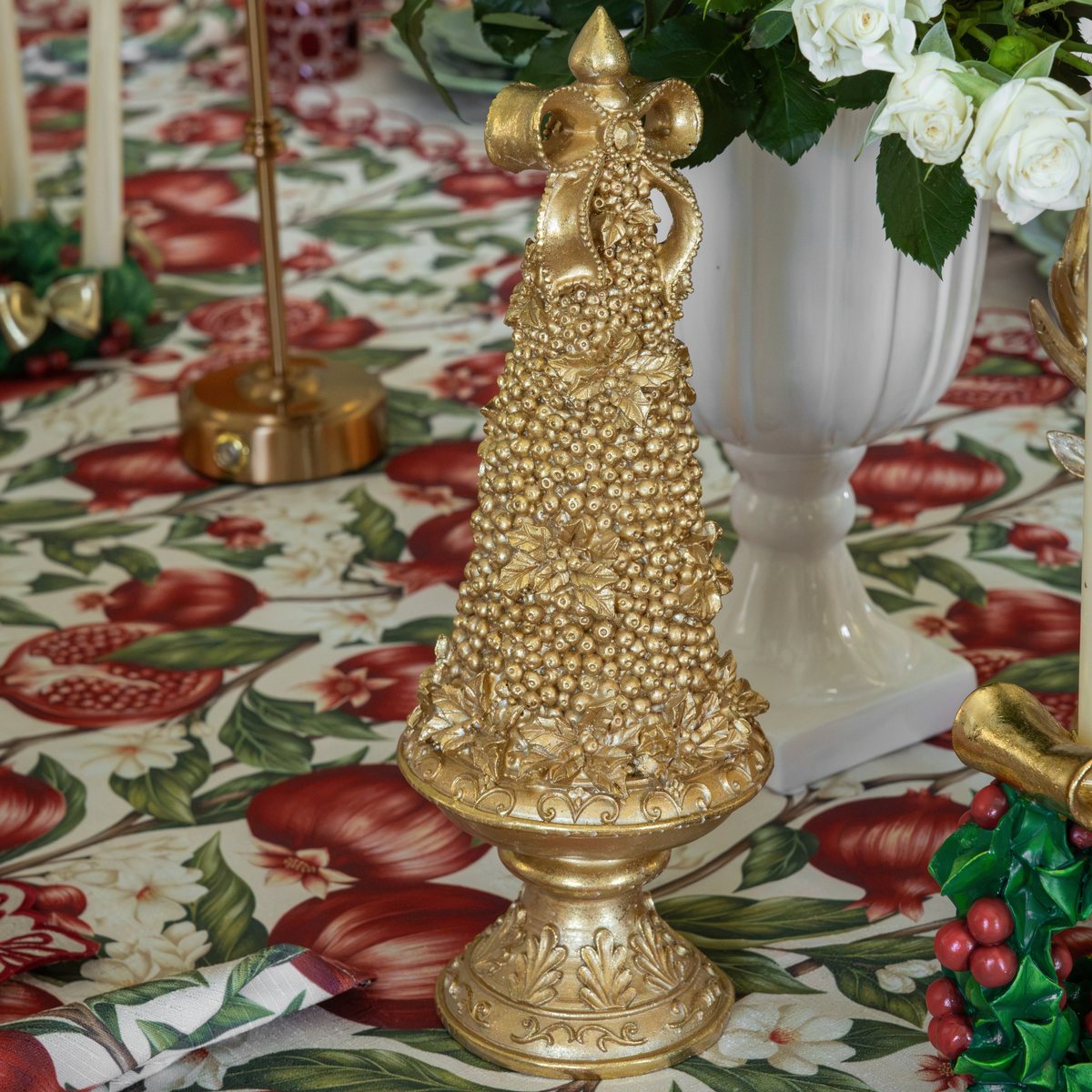 Pomegranate Christmas table styled with gold Christmas tree