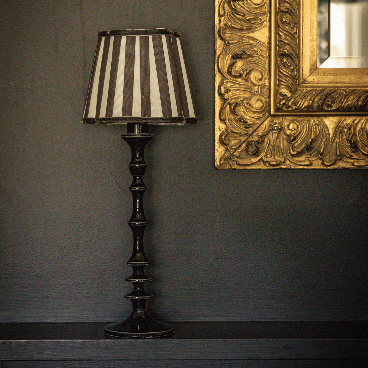 Spruce and Black Bow Christmas table styled with black stripe lamp shade and black lamp base