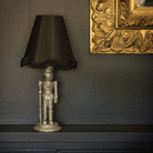 Spruce and Black Bow Christmas table styled with silver nutcracker lamp and black ruffle lamp shade