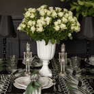 Spruce and Black Bow Christmas table styled with silver nutcrackers, black lamp base and black ruffle lamp shade
