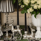 Spruce and Black Bow Christmas table styled with silver deer candle holders, black taper candles and silver hammered lamp base