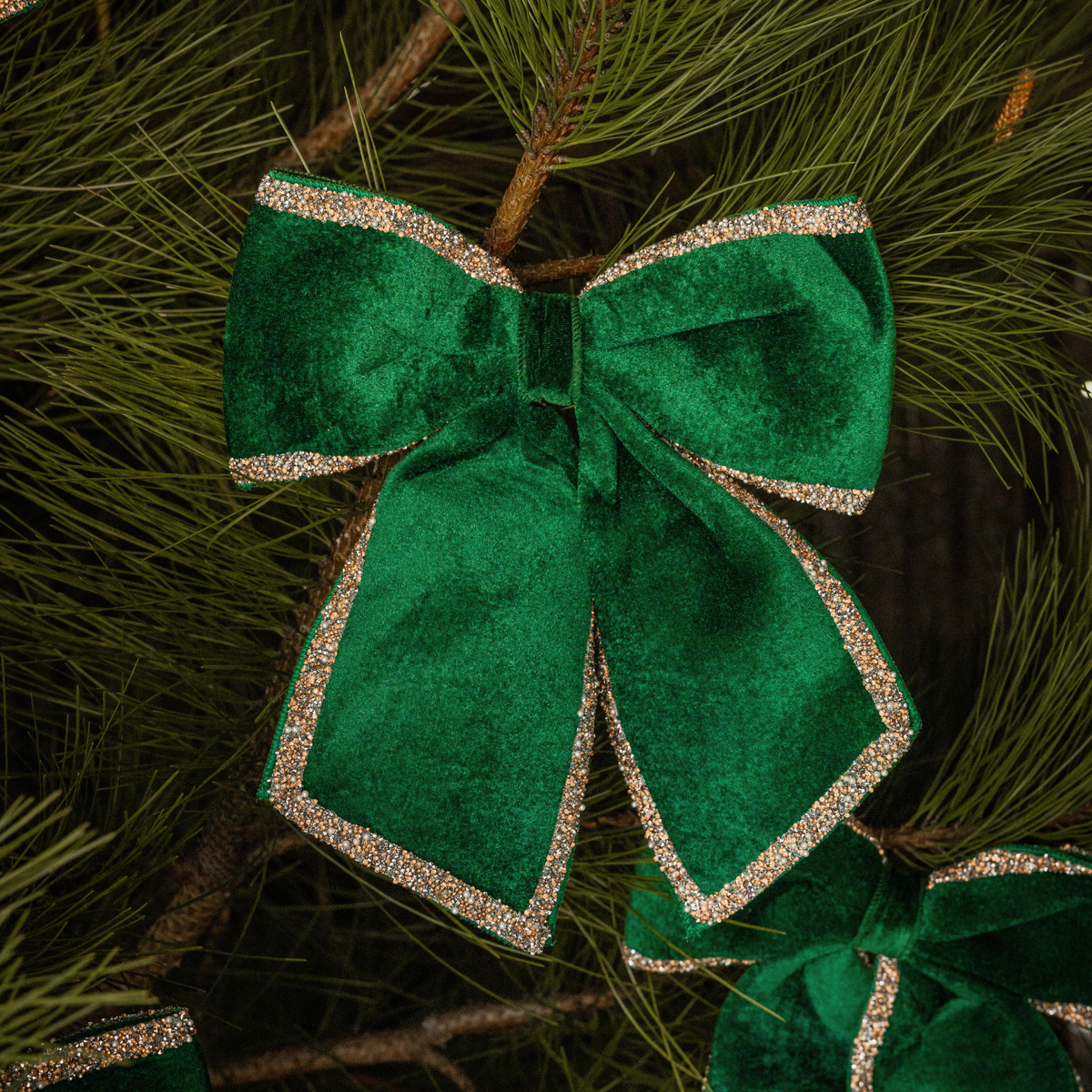 Green Toile Christmas table styled with green velvet glitter trim bows