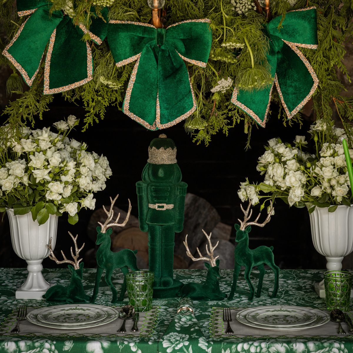 Green Toile Christmas table styled with dark green velvet nutcracker and dark green velvet reindeer