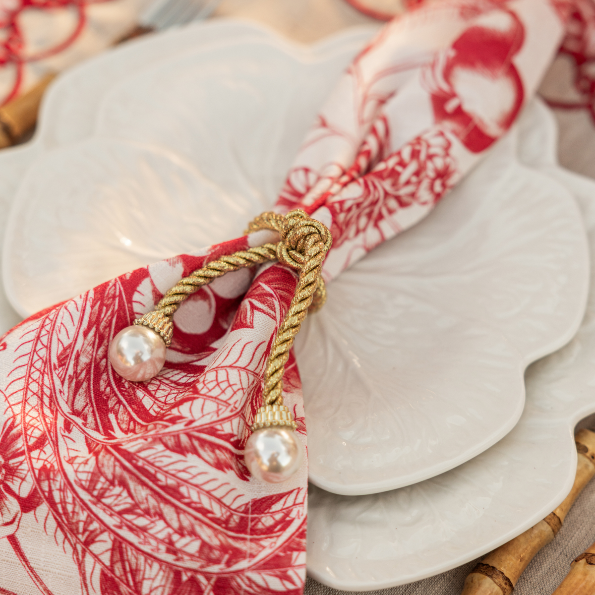 Red Toile Christmas table styled with pearl napkin rings and Red Toile napkins