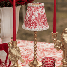 Red Toile Christmas table styled with Red Toile lamp shade, gold hammered lamp base and gold bird candle holders