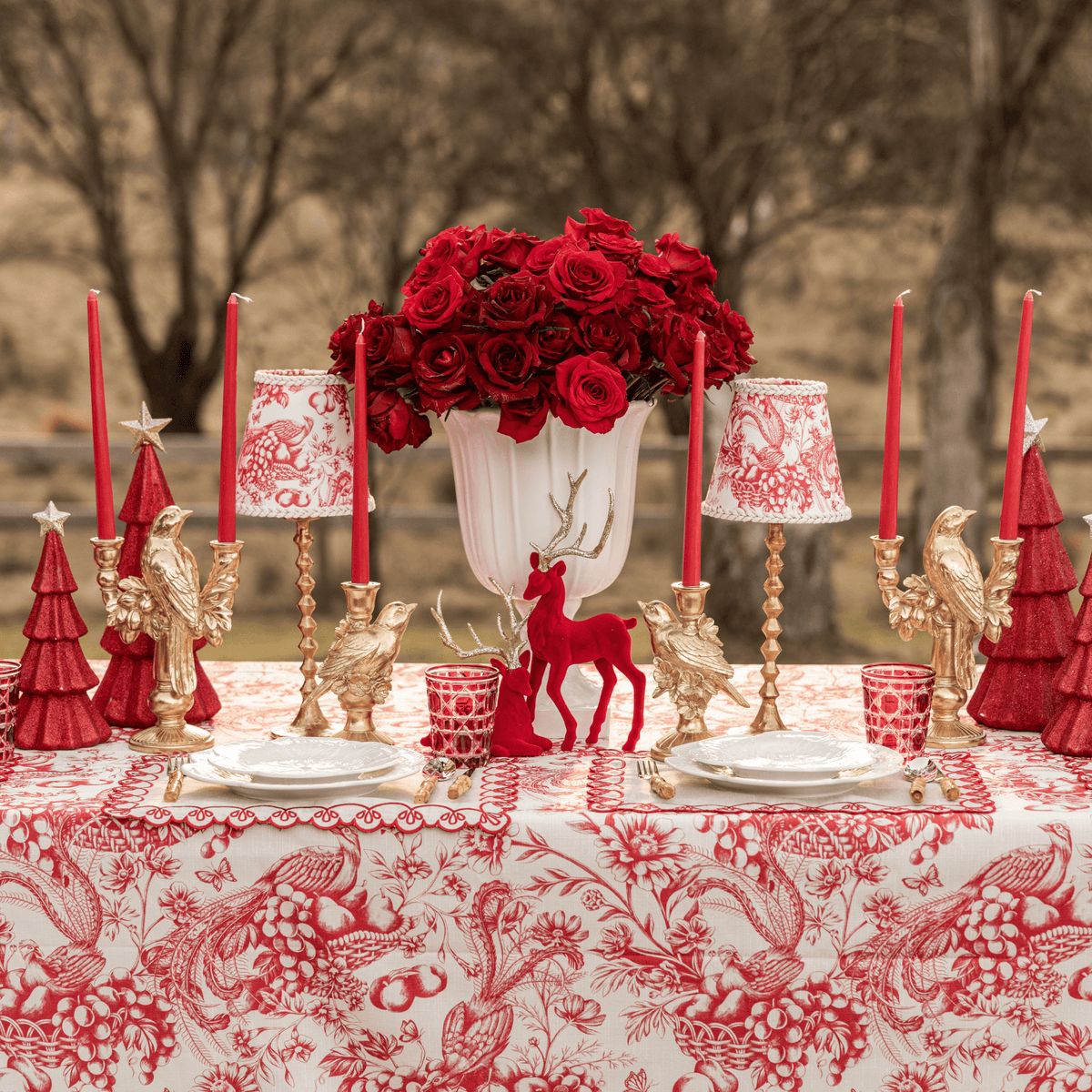 Red Toile Christmas table styled with Red Toile table cloth, Red Toile lamp shade and gold bird double candle holder