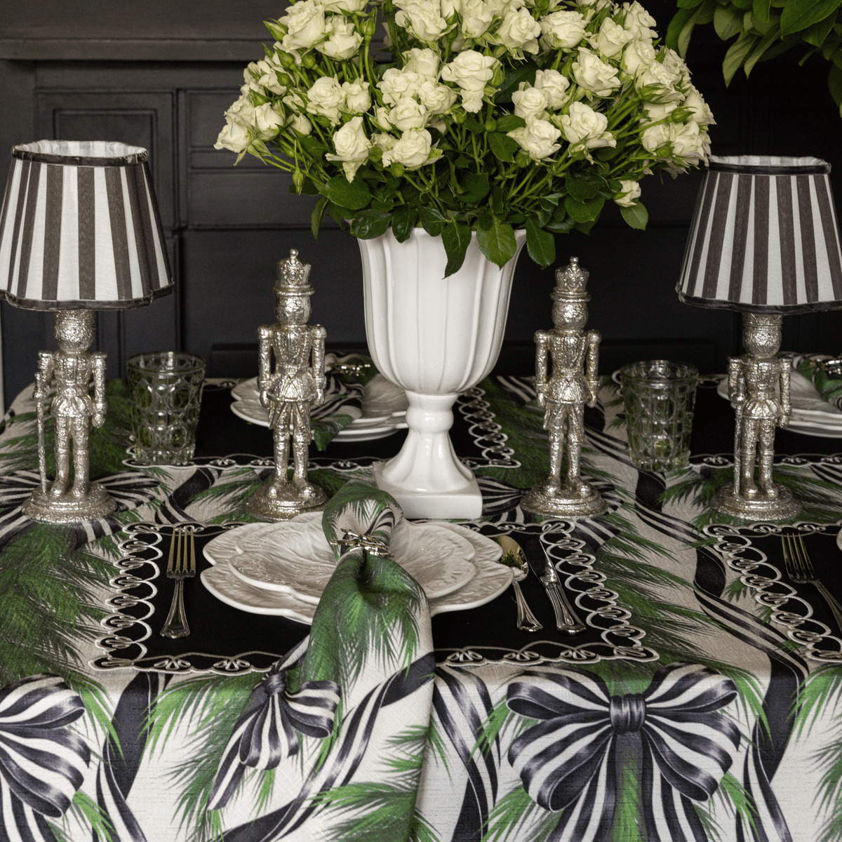 Spruce and Black Bow Christmas table styled with Spruce and Black Bow table cloth, Spruce and Black Bow napkins and silver nutcracker lamp
