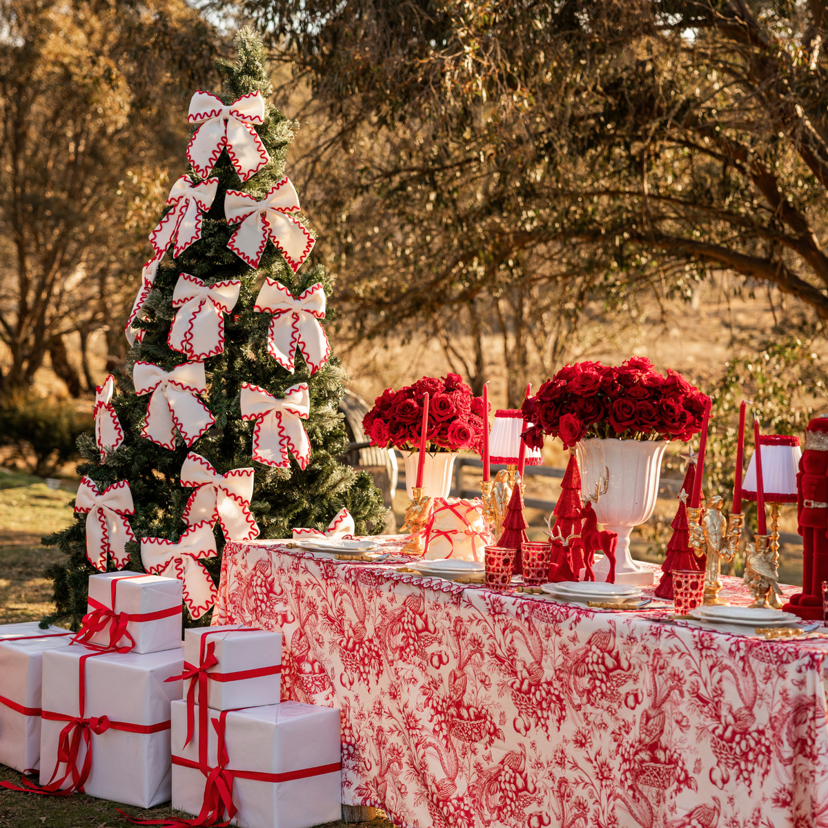 Red Toile Christmas table styled with Red Toile table cloth and cream and red ric rac bows