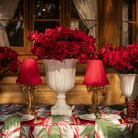 Spruce and Red Bow Christmas table styled with gold bow lamp and red ruffle lamp shade