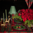 Red Tartan Christmas table styled with Red Tartan table cloth, red placemats with green embroidery and green cabbage plates