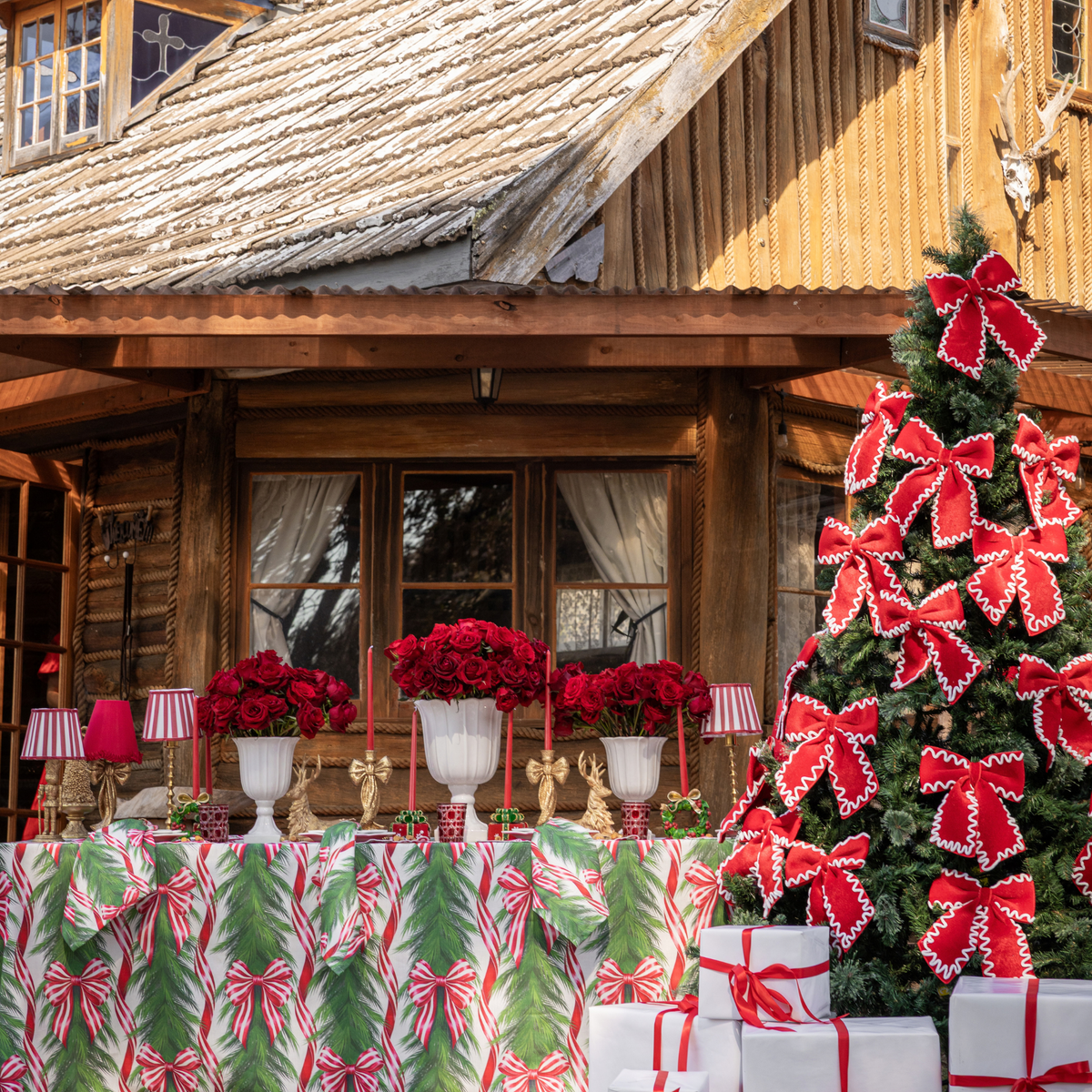 Spruce and Red Bow Christmas table styled with Spruce and Red Bow table cloth and red and ivory ric rac bows
