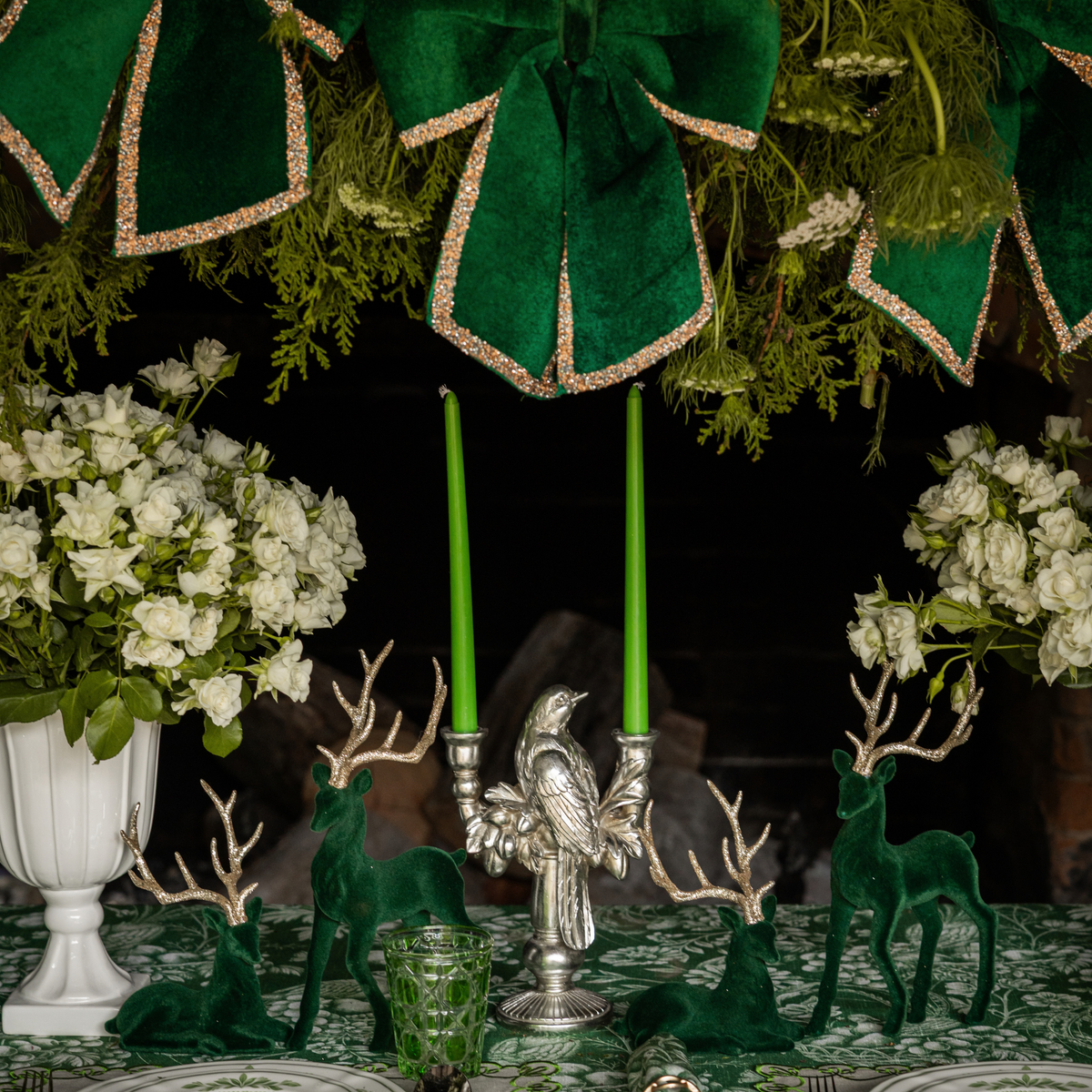 Green Toile Christmas table styled with silver bird double candle holder and dark green velvet reindeer
