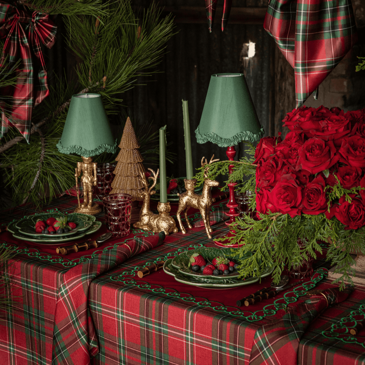 Red Tartan Christmas table styled with gold nutcracker lamp, olive ruffle lamp shade and Rouge lamp base