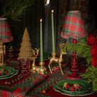Red Tartan Christmas table styled with dark brown rattan Christmas trees, gold deer candle holders and Red Tartan ruffle lamp shade