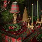 Red Tartan Christmas table styled with Red Tartan ruffle lamp shade, gold nutcracker lamp and dark brown rattan Christmas trees