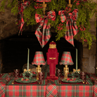 Red Tartan Christmas table styled with burgundy velvet nutcracker, gold nutcracker lamp and Red Tartan ruffle lamp shade