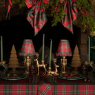 Red Tartan Christmas table styled with gold nutcracker lamp, Red Tartan ruffle lamp shade and dark brown rattan Christmas trees