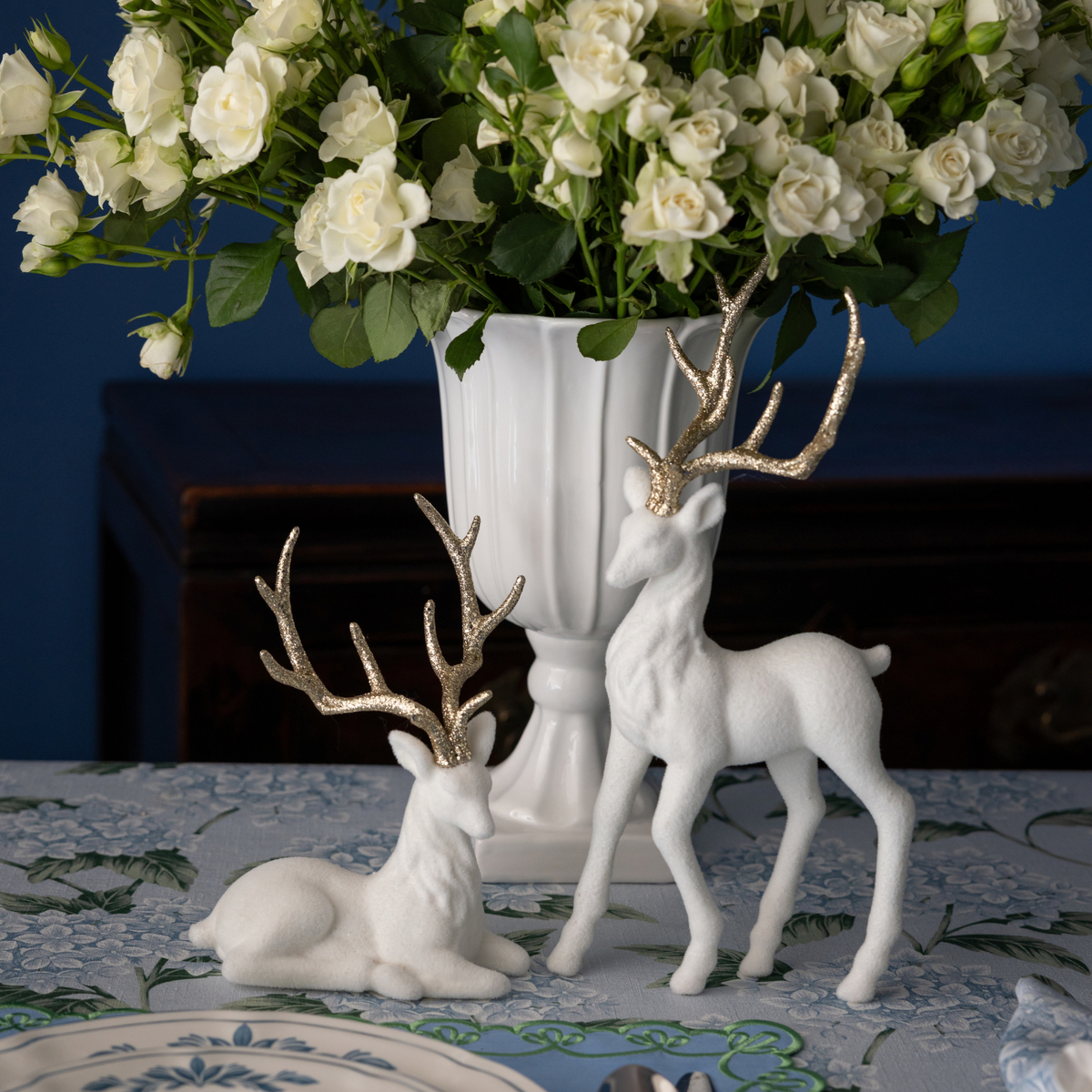 Blue Hydrangea Christmas table styled with cream velvet reindeer