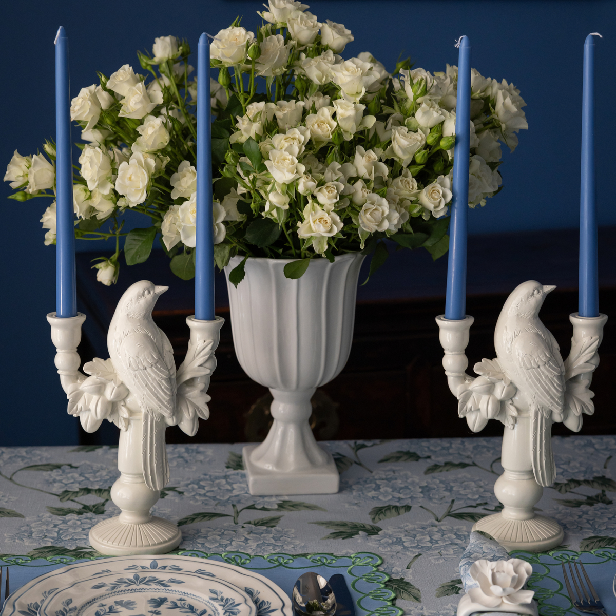 Blue Hydrangea Christmas table styled with white bird double candle holder and pale blue taper candles