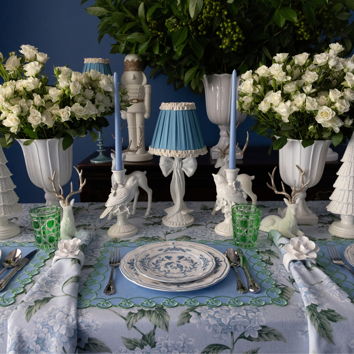Blue Hydrangea Christmas table styled with white bow lamp, Audrey sky blue and cream shade and white bird candle holders