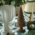 Green and Black Plaid Christmas table styled with dark brown rattan Christmas trees