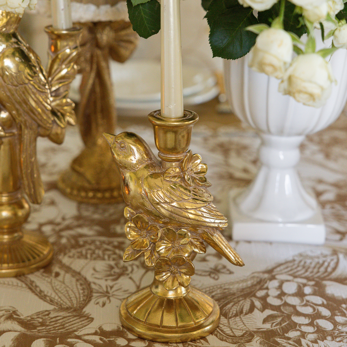 Gold Toile Christmas table styled with gold bird candle holders