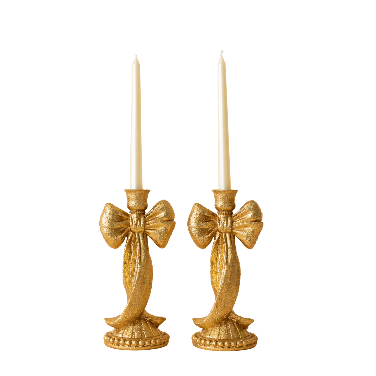 Pair of gold leaf bow candle holders with taper candles